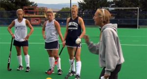 Penn State field hockey coach at the training session. Penn State athletes enjoys exceptional facilities as well as scholarship opportunities.